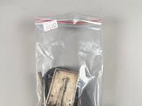 a bag of small pieces of wood sitting on a shelf