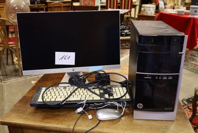 a desktop computer sitting on a table with a keyboard and mouse