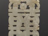 an image of a white jade plaque with a design on it