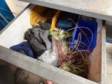 a person that is holding a cell phone in a drawer