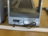 a tread machine that is sitting on a wooden floor