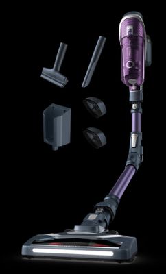 un gros plan d'un aspirateur violet sur fond noir