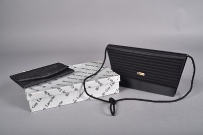 clutch bag and wallet on a white background with a black cord