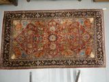 a rug hanging on a wall in a room