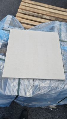 a white sheet of paper on top of a pile of pallets