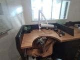a desk with a chair and a computer on top of it