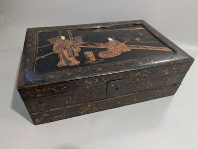 a small wooden box that has a painting on it