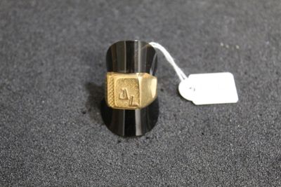 a ring that has a tag on it on a table