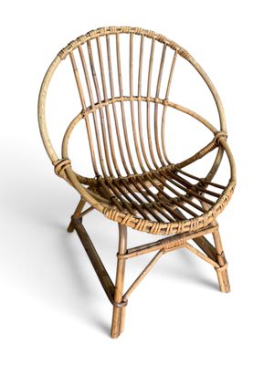 an image of a chair made out of bamboo sticks on a white background