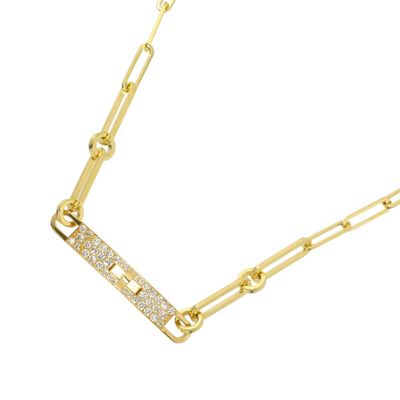 a close up of a gold chain with a diamond bar on it