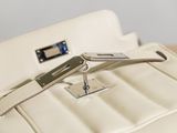 a white purse sitting on top of a table