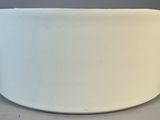 a white bowl sitting on a table with a gray background