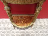 a small table with a clock on top of it