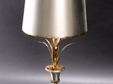 an image of a table lamp with a gold shade on it