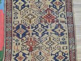 a rug on a wooden floor with a wooden floor and wooden flooring
