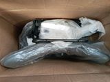 a cardboard box with a laptop inside of it