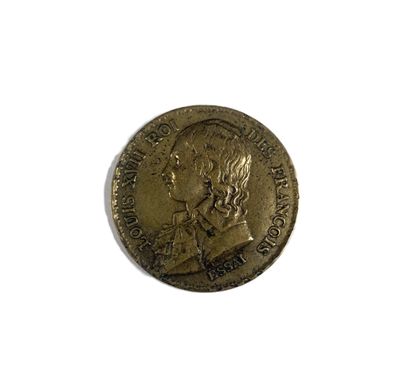 a close up of a coin on a white surface with a white background