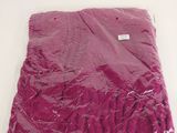 a bag of purple material on a white surface