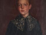 portrait of a young boy in a black dress with a gold collar