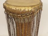 a drum that is sitting on a white surface