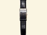 a close up of a watch on a white background