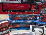 many different types of toy vehicles and trucks on the table