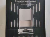 boxed box of a white and black coffee maker sitting on a counter