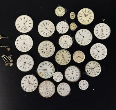 many different types of clocks on a black surface