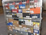 a metal cart with many boxes on it in a warehouse