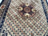 a rug on the floor with a cat sitting on it