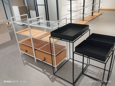 two tables that are on display in a store