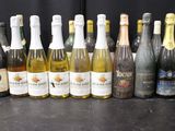 many bottles of wine lined up on a table