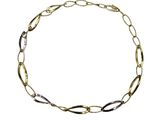 a close up of a gold and silver chain bracelet