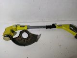 an image of a yellow and black tool on a white surface