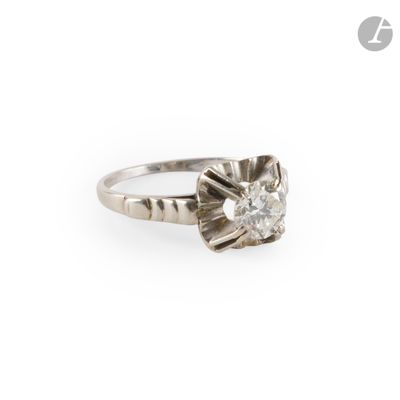 a close up of a diamond ring on a white background