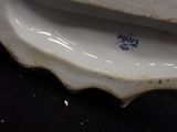 a close up of a white plate with blue writing on it