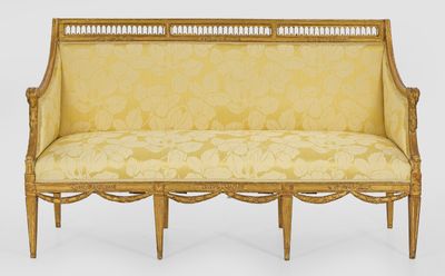 an image of a yellow couch with a floral upholstered back