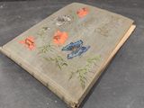 a book with a butterfly design on it on a table