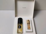 an open box with two bottles of perfume in it