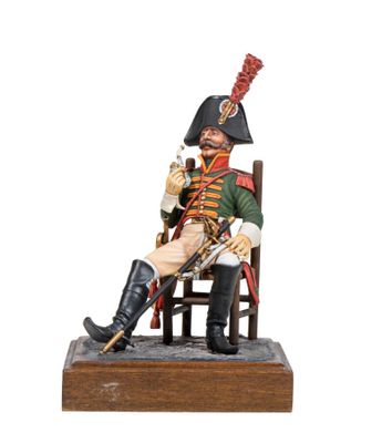 figurine of a soldier sitting on a chair with a cane in his hand