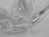 a clear glass vase with a bird on it