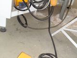 a machine that is sitting on the floor in the garage