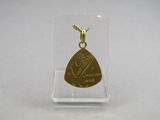 a close up of a gold plated guitar pick pendant on a clear acrylic stand