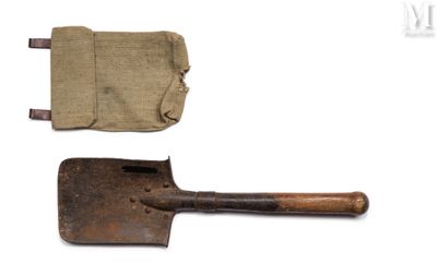 an old shovel with a canvas pouch on it and a pair of old shovels