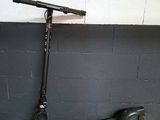 the scooter is leaning against the wall next to the wall