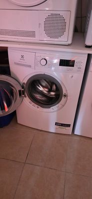 a washer and a dryer in a small room