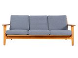 an image of a blue couch sitting on top of a wooden frame