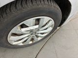 a close up of a tire on the side of the road