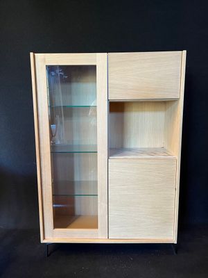 an image of a cabinet with a glass door