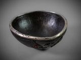 a black bowl that is sitting on a table